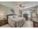 Spacious main bedroom with a king-size bed and wicker furniture at 3801 S Atlantic Ave # 304, New Smyrna Beach, FL 32169