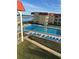 Inviting pool area with ocean view and lounge chairs at 3801 S Atlantic Ave # 304, New Smyrna Beach, FL 32169