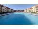 Large, refreshing swimming pool in a sunny courtyard at 3801 S Atlantic Ave # 304, New Smyrna Beach, FL 32169