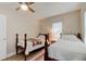 Charming bedroom with two twin beds and a ceiling fan at 388 N Glencoe Rd, New Smyrna Beach, FL 32168