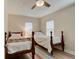 Two twin beds in a bright bedroom with wood flooring at 388 N Glencoe Rd, New Smyrna Beach, FL 32168