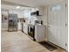 Well-lit kitchen with white cabinets, stainless steel appliances, and modern black hardware at 388 N Glencoe Rd, New Smyrna Beach, FL 32168