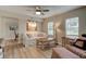 Living Room with white couch and wood floors at 388 N Glencoe Rd, New Smyrna Beach, FL 32168