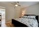 Bedroom featuring ceiling fan, white walls, and a closet, with bed and furniture at 388 N Glencoe Rd, New Smyrna Beach, FL 32168