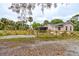 This home is surrounded by a wooden fence, and has plenty of space for parking at 388 N Glencoe Rd, New Smyrna Beach, FL 32168