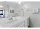 Bathroom with vanity, sink, and mirror at 4139 S Atlantic Ave # A307, New Smyrna Beach, FL 32169