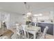 Dining area with white table and chairs at 4139 S Atlantic Ave # A307, New Smyrna Beach, FL 32169