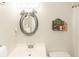 Bright bathroom featuring white vanity, toilet and shower at 4155 S Atlantic Ave # 111, New Smyrna Beach, FL 32169