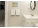 Small bathroom with white vanity and toilet at 4155 S Atlantic Ave # 111, New Smyrna Beach, FL 32169