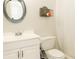 Clean bathroom with white vanity, toilet and shower at 4155 S Atlantic Ave # 111, New Smyrna Beach, FL 32169