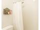 Simple bathroom with shower, toilet, and white walls at 4155 S Atlantic Ave # 111, New Smyrna Beach, FL 32169