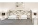 Bedroom with king-size bed and ornate headboard at 4155 S Atlantic Ave # 111, New Smyrna Beach, FL 32169