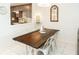 Dining area with farmhouse table and white chairs at 4155 S Atlantic Ave # 111, New Smyrna Beach, FL 32169