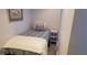 Small bedroom with twin bed and simple decor at 4155 S Atlantic Ave # 5090, New Smyrna Beach, FL 32169