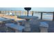 Oceanfront patio with table and benches at 4155 S Atlantic Ave # 5090, New Smyrna Beach, FL 32169