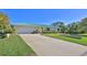 Front view of charming house with green metal roof at 417 N Riverside Dr, Edgewater, FL 32132