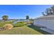 Landscaped backyard with water access and private dock at 417 N Riverside Dr, Edgewater, FL 32132