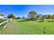 Expansive grassy yard with white fence and water views at 417 N Riverside Dr, Edgewater, FL 32132