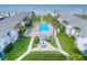 Aerial view of community pool, beach access, and oceanfront location at 4225 S Atlantic Ave # 144, New Smyrna Beach, FL 32169