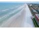 Aerial view of beachfront property with ocean and homes at 4225 S Atlantic Ave # 144, New Smyrna Beach, FL 32169