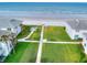 Walkway to beach from community with lush lawn and seating area at 4225 S Atlantic Ave # 144, New Smyrna Beach, FL 32169