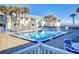 Refreshing community pool with plenty of seating at 4225 S Atlantic Ave # 144, New Smyrna Beach, FL 32169