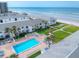 Complex pool and patio area, steps from beach at 4225 S Atlantic Ave # 144, New Smyrna Beach, FL 32169