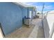 Backyard with gravel pathway and AC unit at 4367 S Peninsula Dr, Ponce Inlet, FL 32127