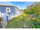 Side yard with grassy area and stone border at 4367 S Peninsula Dr, Ponce Inlet, FL 32127