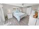 Main bedroom with white furniture and wood-look floors at 4367 S Peninsula Dr, Ponce Inlet, FL 32127