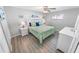 Main bedroom with king-size bed and updated flooring at 4367 S Peninsula Dr, Ponce Inlet, FL 32127