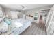 Main bedroom with white furniture and wood-look floors at 4367 S Peninsula Dr, Ponce Inlet, FL 32127