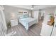 Main bedroom with white furniture and wood-look floors at 4367 S Peninsula Dr, Ponce Inlet, FL 32127