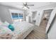 Bedroom with pool view, featuring a queen bed and updated flooring at 4367 S Peninsula Dr, Ponce Inlet, FL 32127