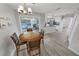 Bright dining area with wood table and access to pool at 4367 S Peninsula Dr, Ponce Inlet, FL 32127