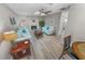 Light and airy living room with fireplace and wood floors at 4367 S Peninsula Dr, Ponce Inlet, FL 32127