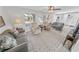 Spacious living room featuring gray sofas and wood-look floors at 4367 S Peninsula Dr, Ponce Inlet, FL 32127