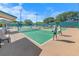 Well-lit pickleball courts with benches at 4367 S Peninsula Dr, Ponce Inlet, FL 32127