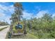 Wooden sign depicting the Ponce Inlet lighthouse and landscape at 4367 S Peninsula Dr, Ponce Inlet, FL 32127