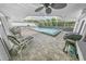 Relaxing pool area with covered patio and grill at 4367 S Peninsula Dr, Ponce Inlet, FL 32127