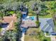 Attractive home with a pool, surrounded by lush landscaping at 4514 Saxon Dr, New Smyrna Beach, FL 32169