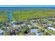 Aerial view of waterfront homes and lush landscape at 4514 Saxon Dr, New Smyrna Beach, FL 32169