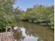 Serene canal view with lush mangrove trees and calm water at 4514 Saxon Dr, New Smyrna Beach, FL 32169