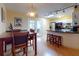 Dining area with kitchen access and a view to the lanai at 4514 Saxon Dr, New Smyrna Beach, FL 32169