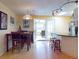 Dining area with kitchen access and a view to the lanai at 4514 Saxon Dr, New Smyrna Beach, FL 32169