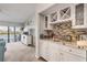 Wet bar with granite countertop and stylish cabinetry at 460 Bouchelle Dr # 304, New Smyrna Beach, FL 32169