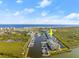 Aerial view of waterfront condo building with marina and ocean views at 4628 Harbour Village Blvd # 2206, Ponce Inlet, FL 32127