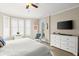 Main bedroom with private balcony access and a dresser at 4628 Harbour Village Blvd # 2206, Ponce Inlet, FL 32127