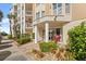 Condo building exterior with landscaped grounds and entrance at 4628 Harbour Village Blvd # 2206, Ponce Inlet, FL 32127