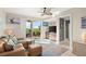 Bright living room with patio access and ceiling fan at 4628 Harbour Village Blvd # 2206, Ponce Inlet, FL 32127